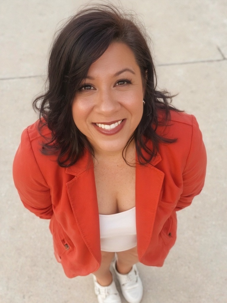 Janice Noehulani. oragne suit